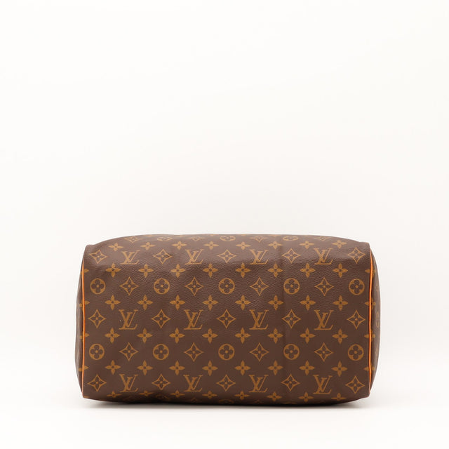 Détail de la fermeture Louis Vuitton Speedy 35 Toile Monogramme occasion authentique — AMANA Vintage