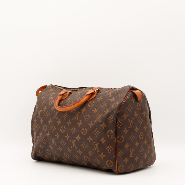 Détail de la tirette Louis Vuitton Speedy 35 cuir vachette occasion authentique — AMANA Vintage