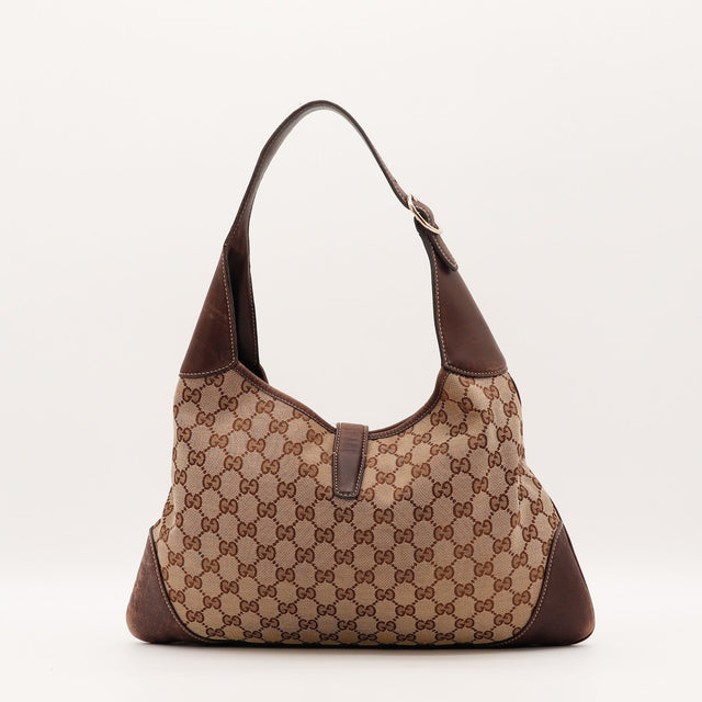 Détail du fermoir piston doré Gucci New Jackie occasion authentique — AMANA Vintage