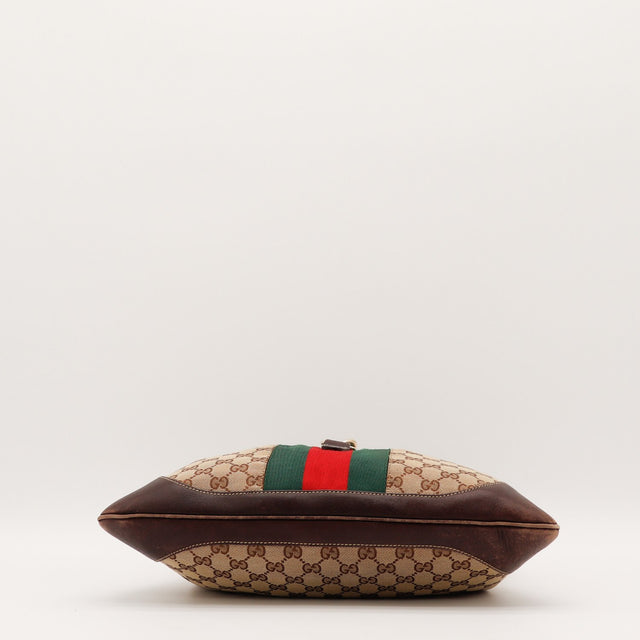 Détail des coins inférieurs Gucci New Jackie cuir marron occasion authentique — AMANA Vintage