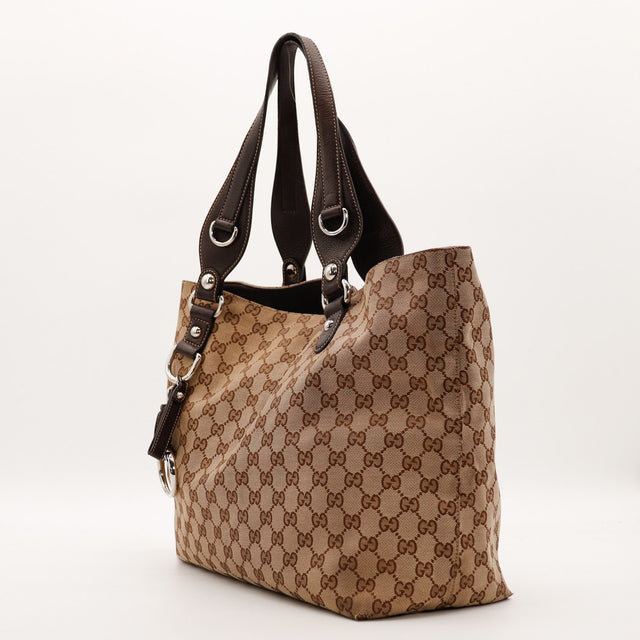 Vue de trois quarts Tote Horsebit Gucci toile monogrammée cuir marron — AMANA Vintage