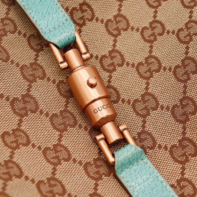 Détail fermoir piston Gucci New Jackie argenterie cuivrée occasion authentique — AMANA Vintage