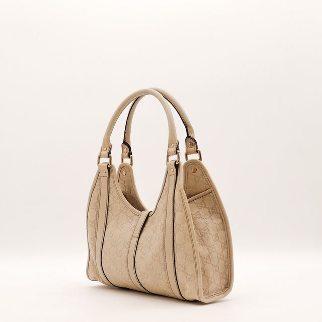 Détail du mousqueton doré Gucci Hobo cuir Guccissima beige occasion authentique — AMANA Vintage