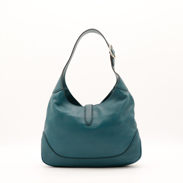 Détail du fermoir piston bambou Gucci New Jackie cuir lisse bleu canard occasion authentique — AMANA Vintage