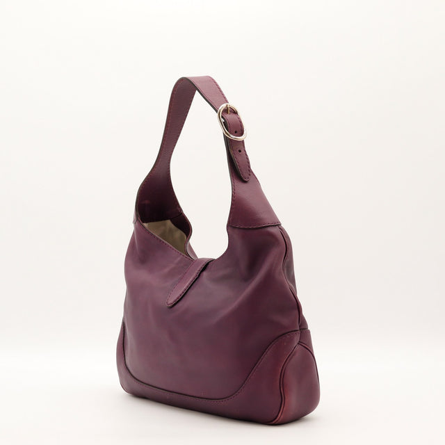 Détail du fermoir piston Gucci New Jackie cuir lisse prune occasion authentique — AMANA Vintage