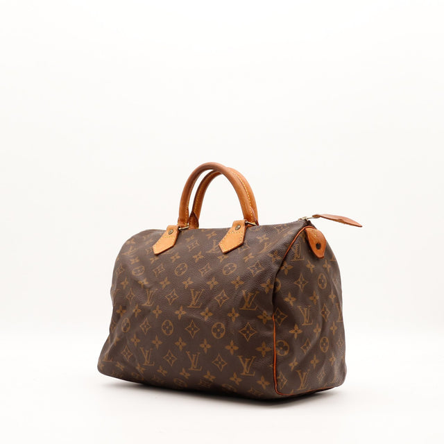 Louis Vuitton Speedy 35 vue trois-quarts toile Monogram cuir vachette caramel — AMANA Vintage