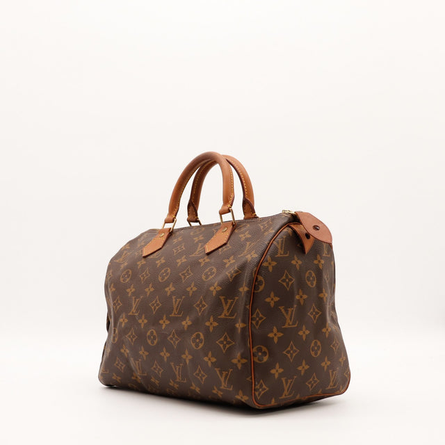 Louis Vuitton Speedy 30 vue trois quarts angle gauche toile monogramme patine caramel — AMANA Vintage