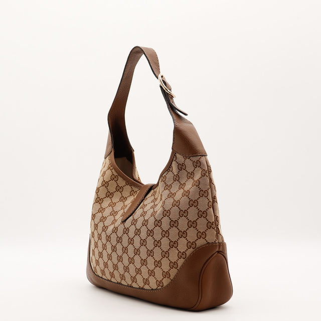 Détail du fermoir piston Gucci New Jackie toile monogrammée occasion authentique — AMANA Vintage