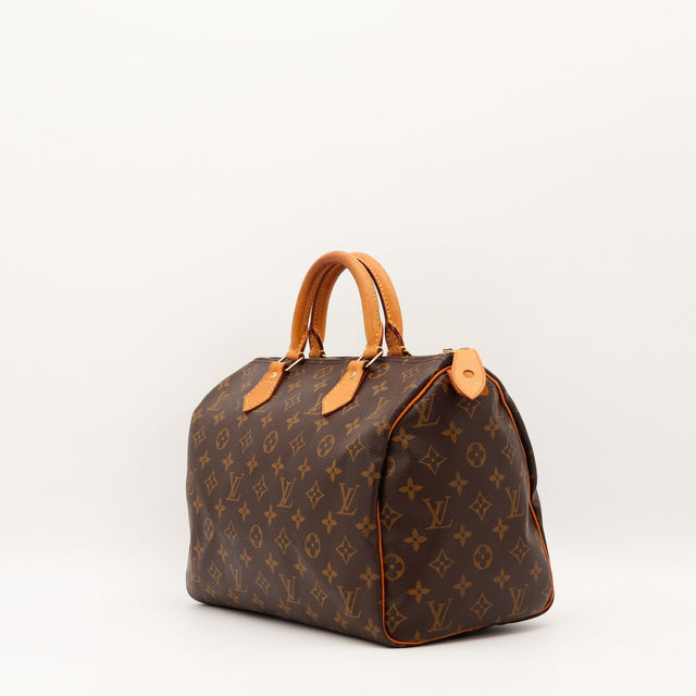 Louis Vuitton Speedy 30 vue de trois quarts cuir vachette patine caramel — AMANA Vintage