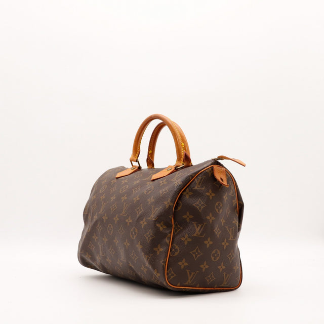 Louis Vuitton Speedy 30 vue de trois quarts toile monogramme patine caramel — AMANA Vintage