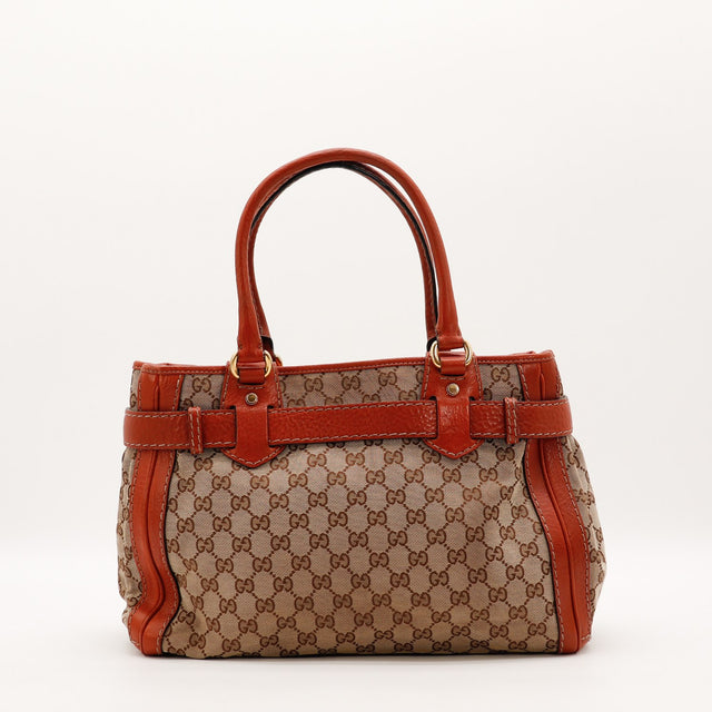 Vue de profil Gucci Tote Running toile monogrammée beige et ébène occasion authentique — AMANA Vintage