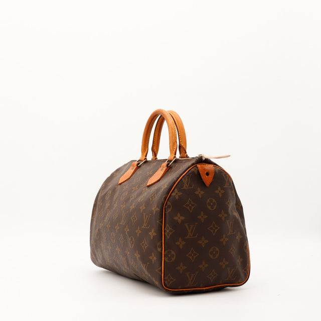 Louis Vuitton Speedy 30 vue trois quarts droite toile Monogram patine caramel — AMANA Vintage