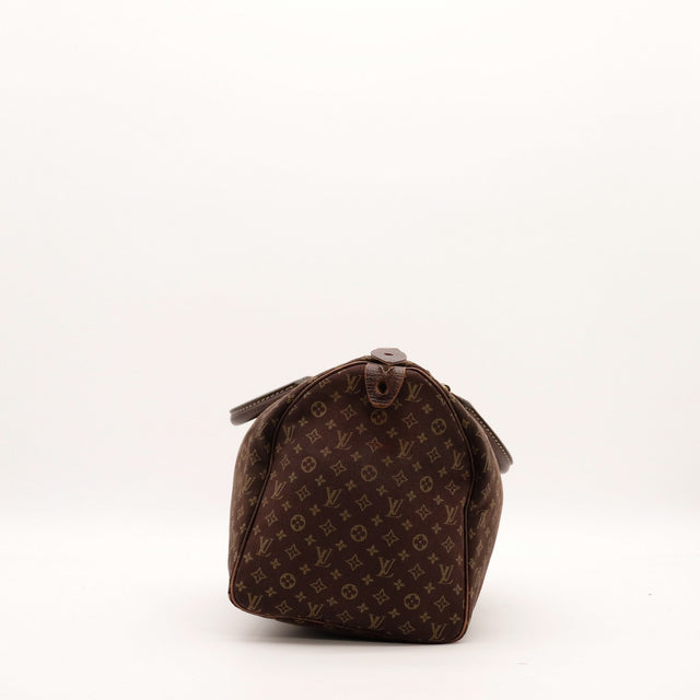 zijaanzicht Louis Vuitton Speedy 30 Mini Lin bodem — AMANA Vintage