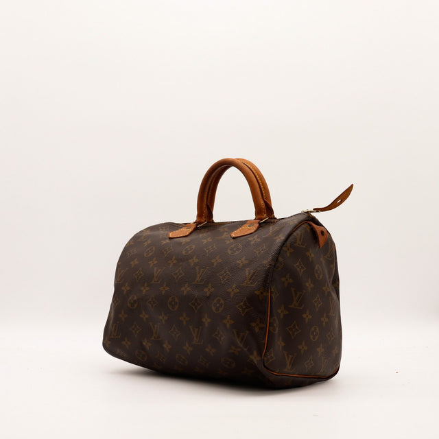 Louis Vuitton Speedy 30 vue trois quarts toile Monogram patine caramel — AMANA Vintage