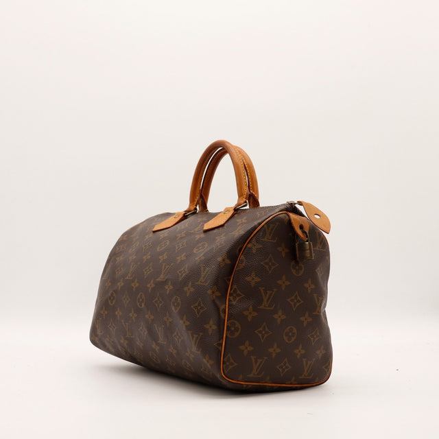 Louis Vuitton Speedy 30 vue trois quarts droite toile Monogramme patine caramel — AMANA Vintage