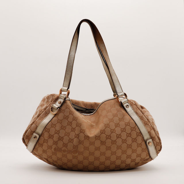 Hobo Gucci toile monogrammée beige et cuir doré vue de face occasion authentique — AMANA Vintage