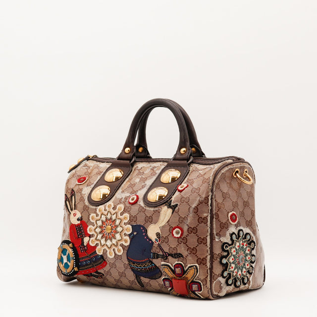 Vue de trois-quarts Gucci Boston Babouska toile monogrammée beige et marron occasion authentique — AMANA Vintage