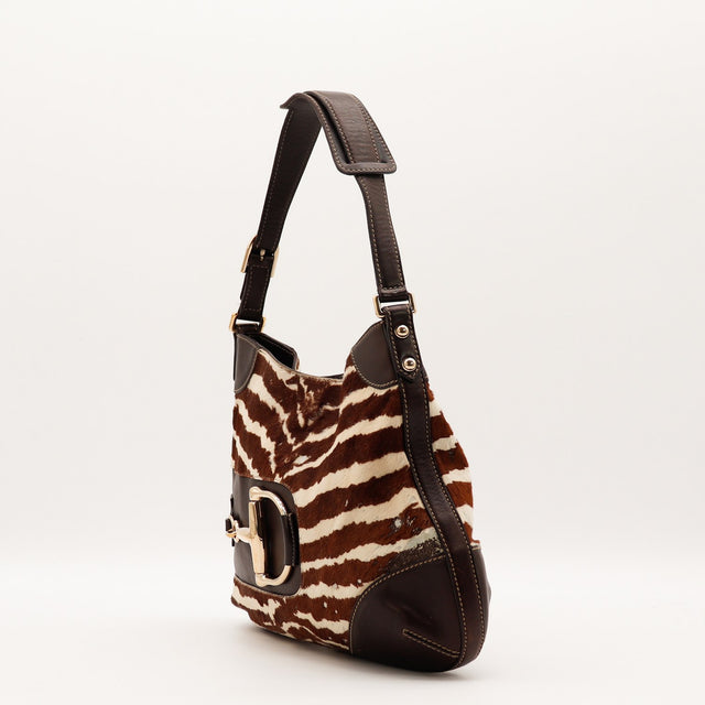 Détail mors doré Gucci Hobo Horsebit poulain zèbre occasion authentique — AMANA Vintage