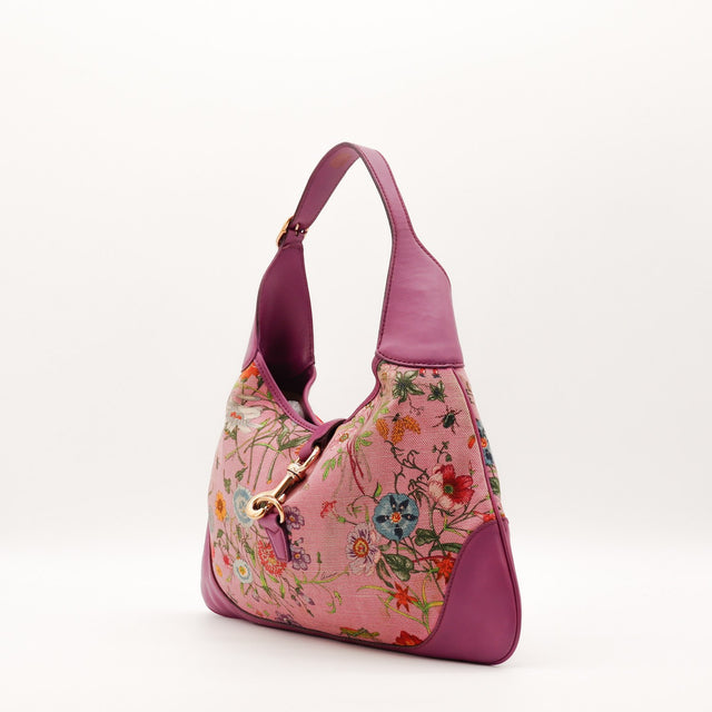 Détail fermoir piston doré Gucci Jackie Flora occasion authentique — AMANA Vintage