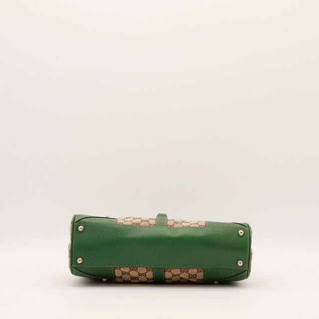 Détail anse en cuir vert Gucci Jackie occasion authentique — AMANA Vintage