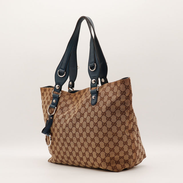 Détail cuir bleu pétrole attaches d'anses Gucci Tote occasion authentique — AMANA Vintage