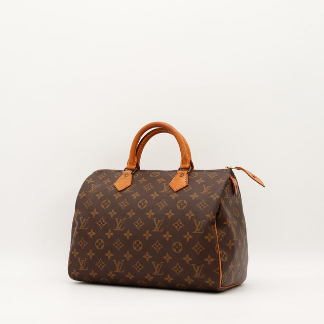Louis Vuitton Speedy 30 vue trois quarts gauche toile monogramme patine caramel — AMANA Vintage