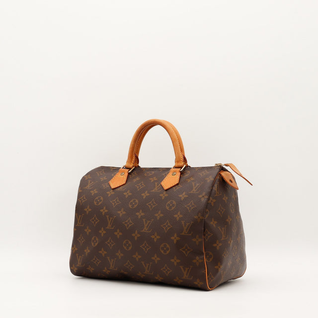 Louis Vuitton Speedy 30 vue trois quarts toile monogrammée cuir vachette caramel — AMANA Vintage