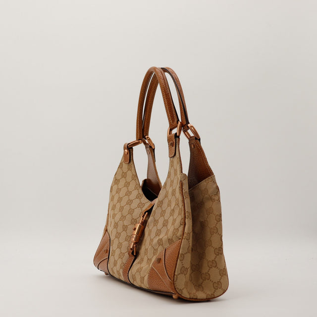 Vue de profil Gucci New Jackie canvas GG et cuir grené marron occasion — AMANA Vintage
