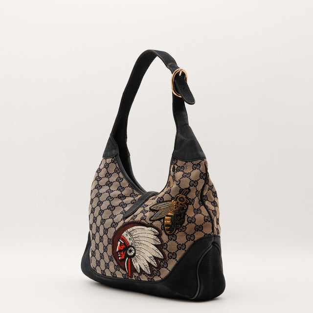Vue latérale Gucci New Jackie broderies toile monogrammée cuir grainé noir — AMANA Vintage