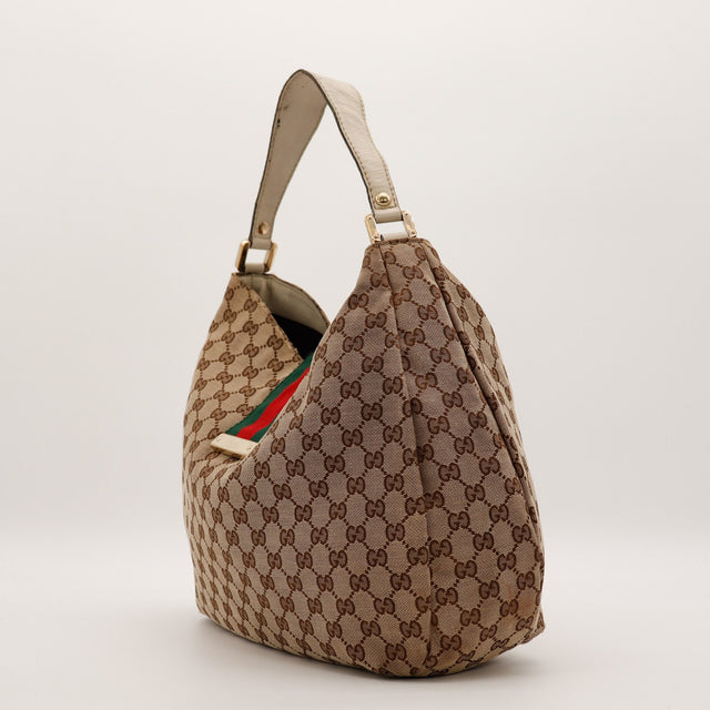 Gucci Hobo Web canvas GG beige vue de profil gauche avec ruban Web vert rouge — AMANA Vintage