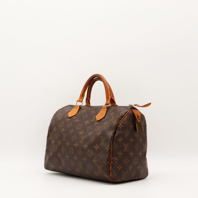 Detail cuir vachette patine caramel Louis Vuitton Speedy 30 — AMANA Vintage