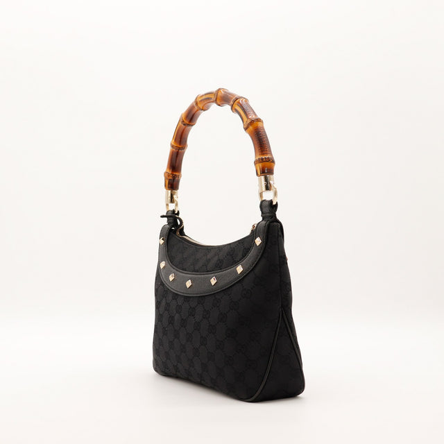 Vue de trois quarts Hobo Bambou Gucci noir clous dorés — AMANA Vintage