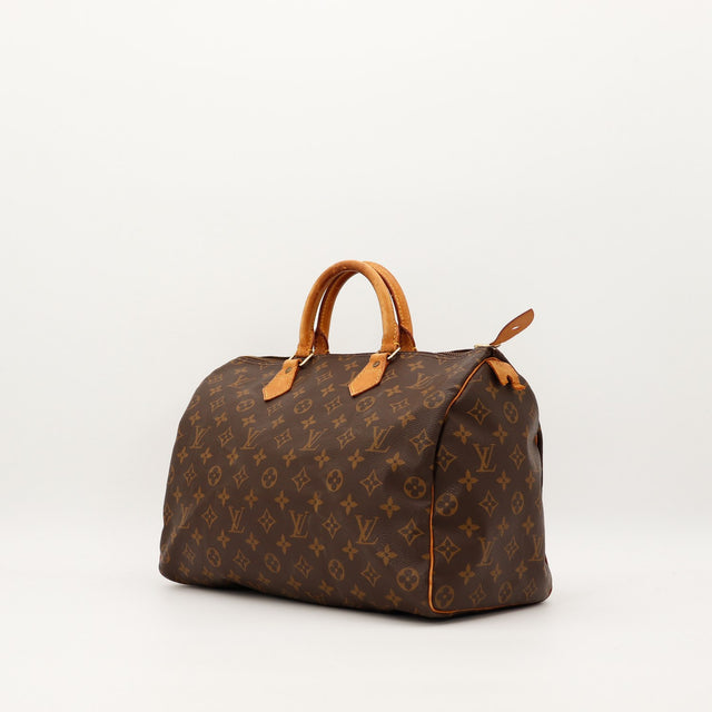 Vue trois quarts Louis Vuitton Speedy 40 anses vachette patine caramel — AMANA Vintage