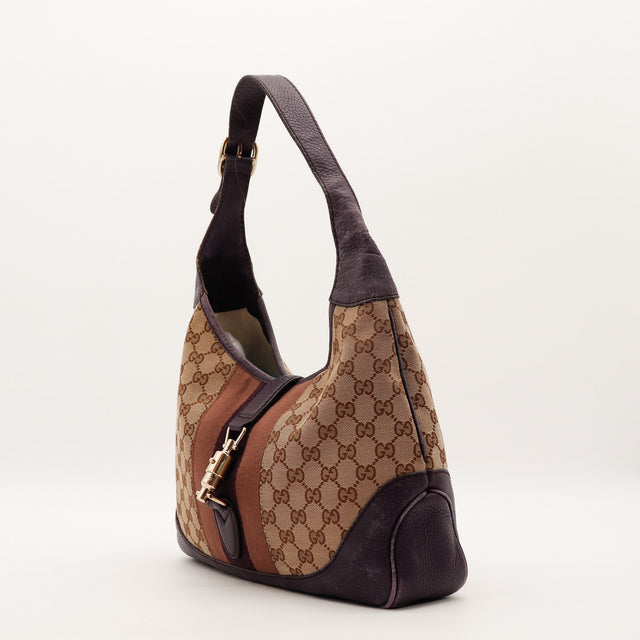 Vue de trois quarts sac Gucci New Jackie toile monogramme cuir grené prune — AMANA Vintage