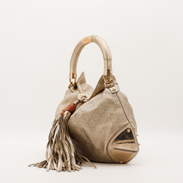 Gucci Indy Hobo vue de profil gauche cuir doré bronze frangé — AMANA Vintage