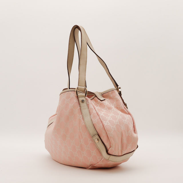 Gucci Hobo rose vue de côté gauche anses cuir grainé beige occasion — AMANA Vintage