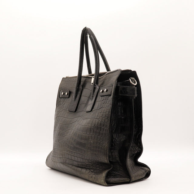 Vue de profil Saint Laurent Sac de Jour Souple cuir embossé façon crocodile noir occasion authentique — AMANA Vintage