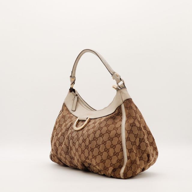Hobo Gucci vue de trois quarts côté droit toile monogrammée ivoire — AMANA Vintage