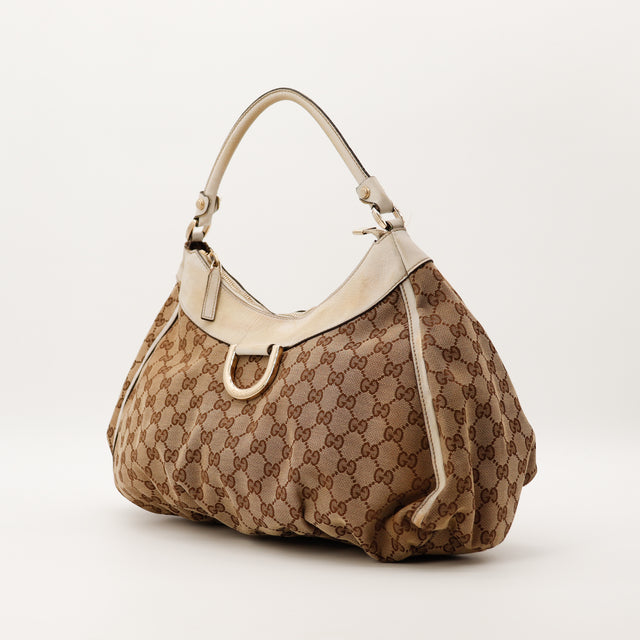 Gucci D-Ring Hobo GG Canvas vue de trois quarts anneau en D dore occasion authentique — AMANA Vintage