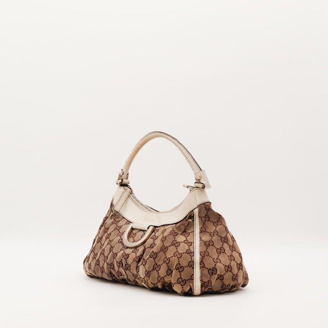 Sac Gucci Hobo toile monogrammée vue de trois quarts gauche occasion — AMANA Vintage