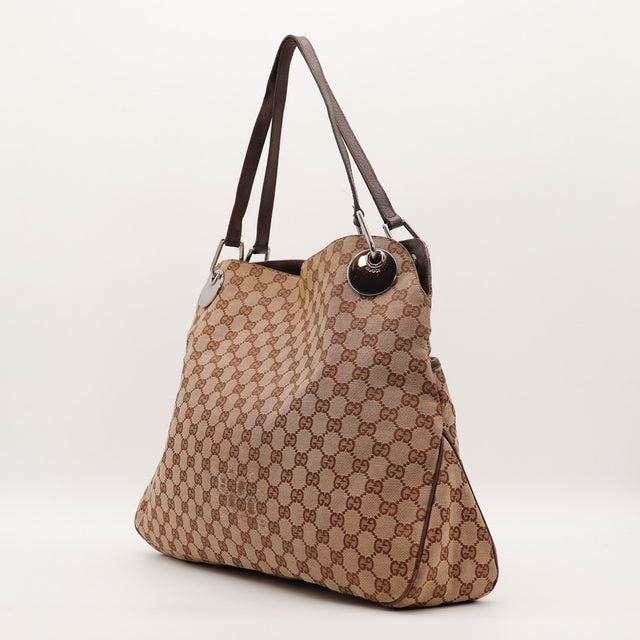 Tote Bag Gucci vista de três quartos lado esquerdo tela monogramada — AMANA Vintage