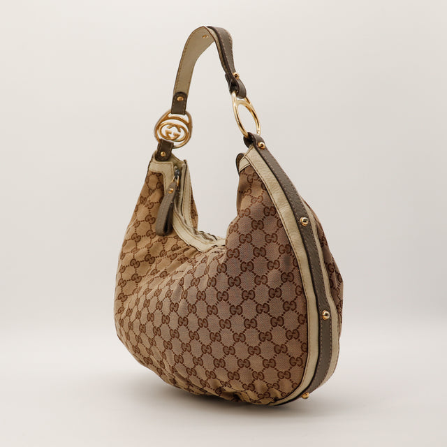 Gucci Hobo Interlocking G toile monogrammée vue trois quarts gauche occasion — AMANA Vintage
