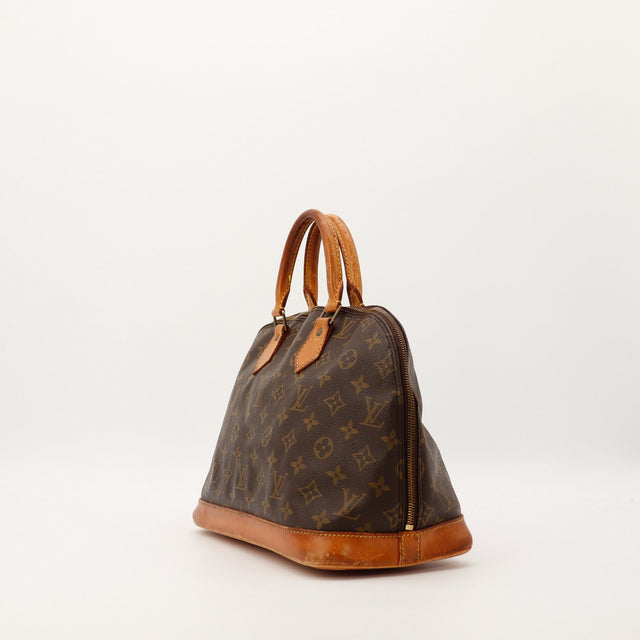 Louis Vuitton Alma PM vue de trois quarts gauche patine caramel occasion — AMANA Vintage