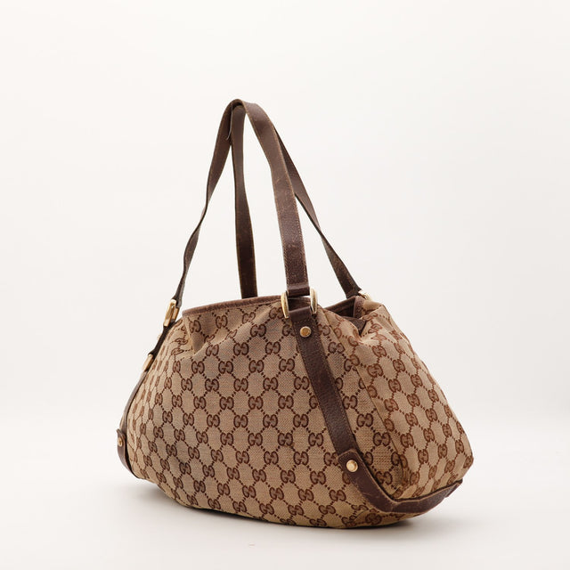 Sac Gucci Hobo toile monogrammée vue de trois quarts occasion authentique — AMANA Vintage
