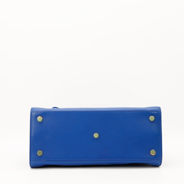 Vue du fond Sac de Jour Saint Laurent bleu pieds dorés occasion authentique — AMANA Vintage