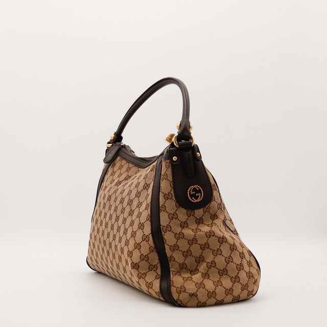 Sac Gucci Hobo toile monogrammée vue de profil occasion authentique — AMANA Vintage