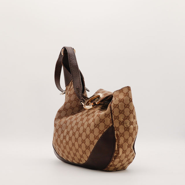 Mala Gucci Hobo GG silhueta flexível vista lateral vintage autêntica — AMANA Vintage