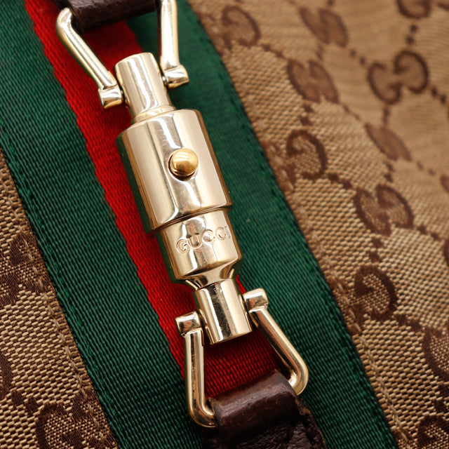 Détail piston doré signé Gucci Jackie occasion authentique — AMANA Vintage