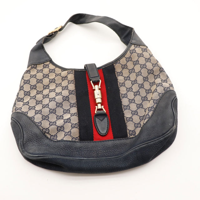Détail de l'anse Gucci New Jackie cuir bleu marine occasion authentique — AMANA Vintage