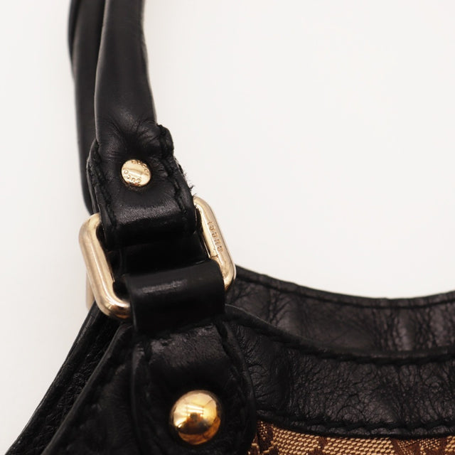 Détail de l'étiquette intérieure Gucci Tote toile monogrammée beige et ébène occasion authentique — AMANA Vintage